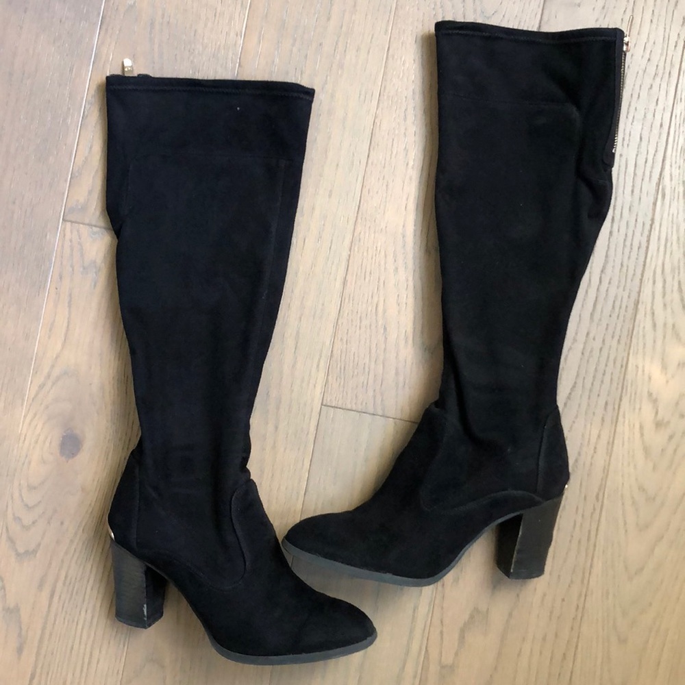 Black Marc Fisher knee high boots.